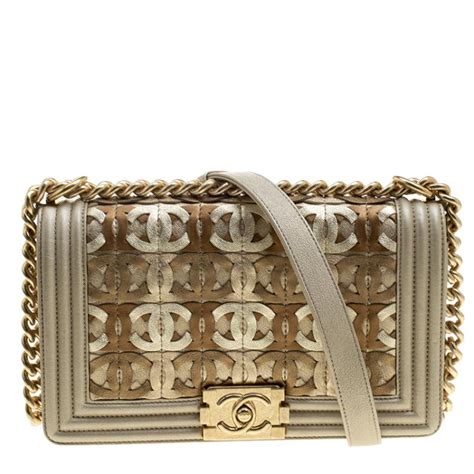 chanel bag beige gold cc cutout leather medium boy flap|BOY CHANEL .